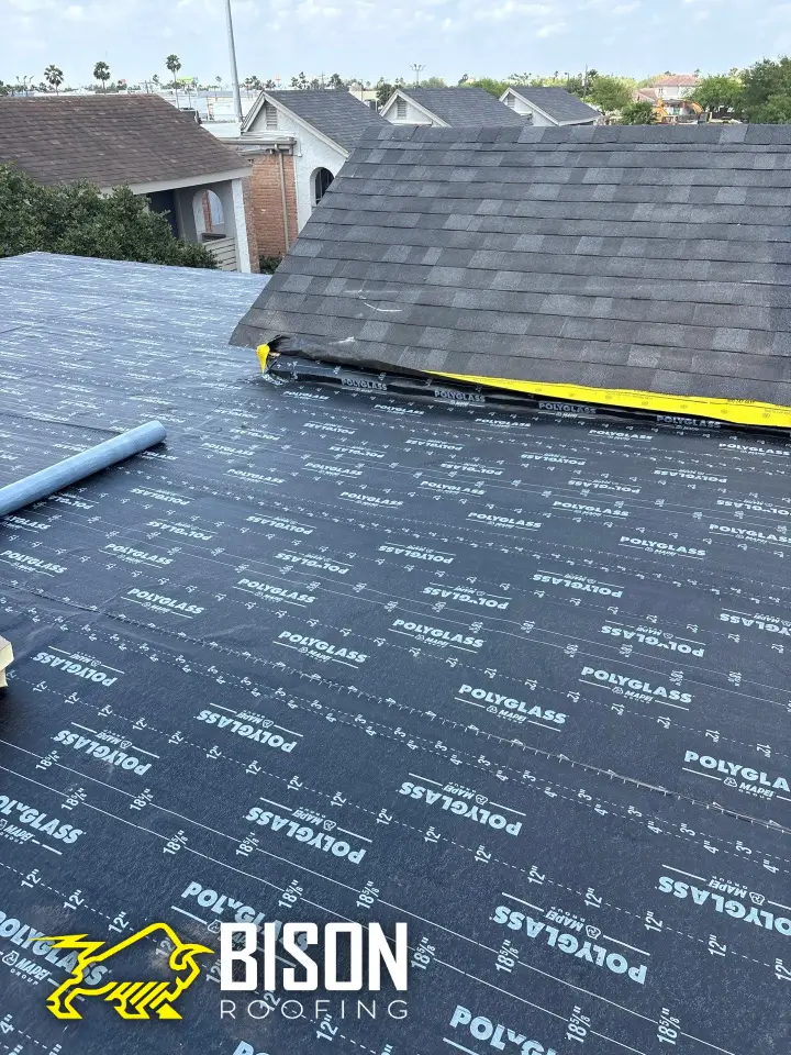 The Pitch Problem: Why Shingles and Low Slopes Don’t Mix Professional installation of low-slope roofing membrane to replace shingles on a flat roof.